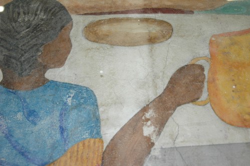 Here's a detail of the mural fragment on display from Haiti's Holy Trinity Cathedral.  It's from one of only 3 (out of 14) murals that survived the January 2010 earthquake.